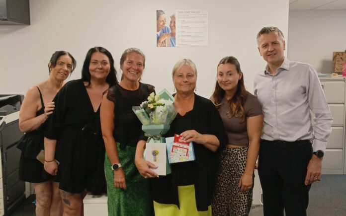 meet the team at lauriem a group of office staff and carer in an office setting